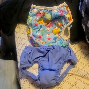 Two Swimming diapers. Size Large and 12 months. Large is Wegreeco adjustable.